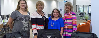 tease Rebecca Goins, Tutor Coordinator, Student Success Center at Brazosport College; Kay Brooks, Adult Education & Literacy Grant Project Manager, Brazosport College; and Krystal Watson, High School Equivalency Coordinator, Brazosport College, recently accepted locally-developed industrial math tool kits for use in their respective areas. The tool bags, which were presented by Brazosport College Workforce Development Director Beth Cassidy, contains triangular architect scales, micrometers, calipers, metal squares and various measuring devices that will be used to provide students with hands-on industrial math tutorial activities. These experiences not only provide students with relevant examples of problems faced in industrial trades, but also have the advantage of engaging students and increasing their interest in and enjoyment of mathematics. Funding for the tools was provided by a Carl Perkins Grant for the Career and Technical Education (CTE) Workforce Programs. Pictured with the Rebecca Goins, Brazosport学院学生成功中心导师协调员;凯·布鲁克斯,巴西体育学院成人教育与扫盲基金项目经理;以及来自Equiva高中的Krystal Watson